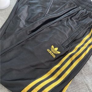 Adidas Black Satin Joggers with Gold Stripes